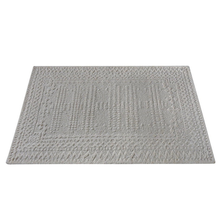 Chowk hand-knotted NZ wool rug in dove grey with a tone-on-tone raised grid and border, under a dining table