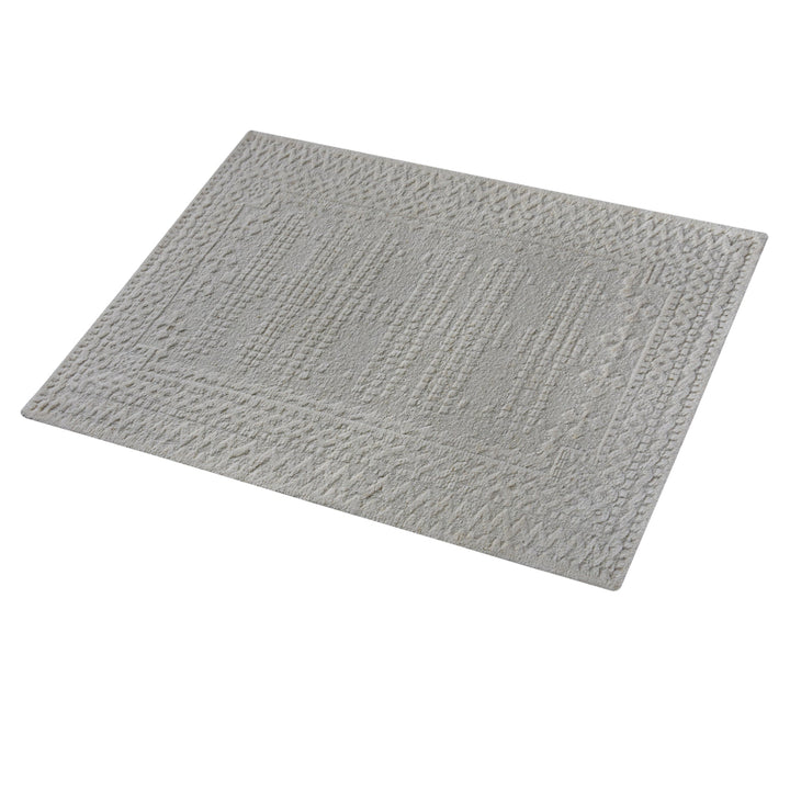 Chowk hand-knotted NZ wool rug in dove grey with a tone-on-tone raised grid and border, under a dining table