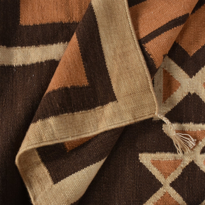Ember flatweave New Zealand wool rug with rust and cream Southwestern diamonds, in an entryway