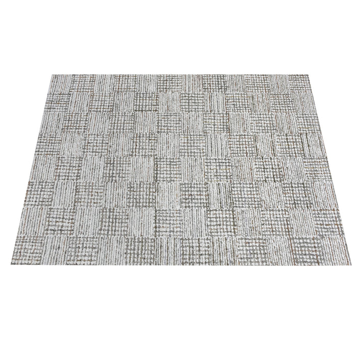Tweed hand-tufted denim and cotton rug with fine grey and ivory check, in a bedroom