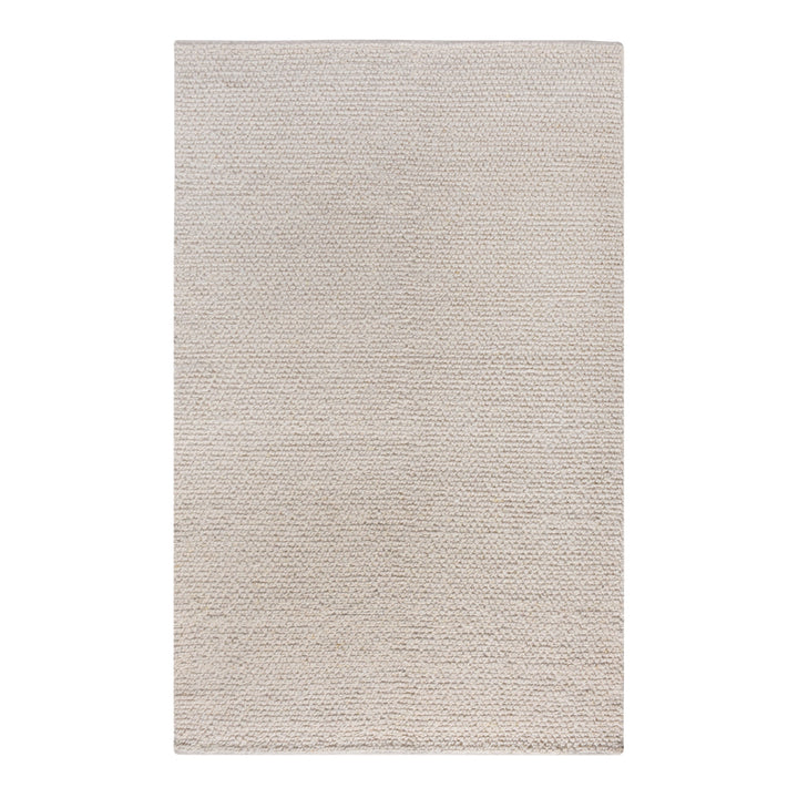 Bunai handwoven wool rug with a chunky looped bouclé surface in oatmeal, in a living room
