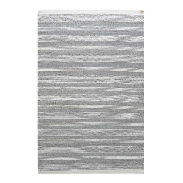 Pinstripe handwoven hemp and wool rug with slate and ivory vertical stripes, in a hallway