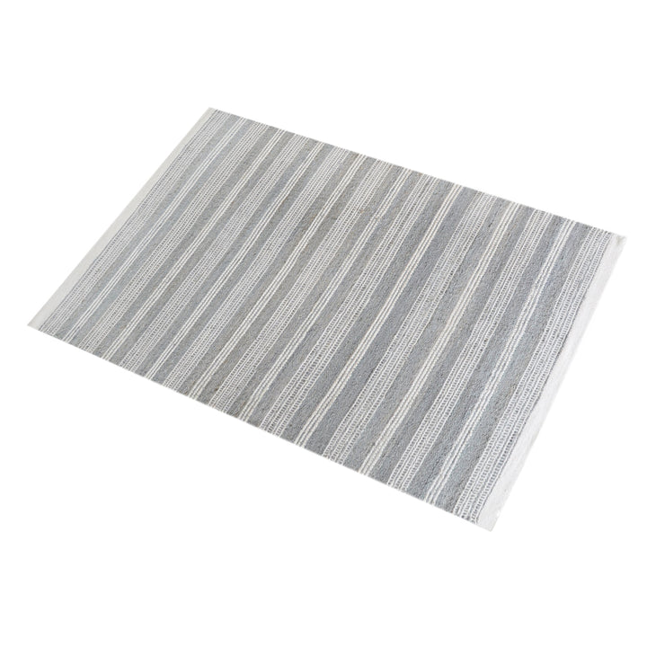 Pinstripe handwoven hemp and wool rug with slate and ivory vertical stripes, in a hallway