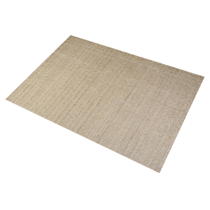 Saada handwoven flat wool rug in solid stone beige with charcoal, in a living room