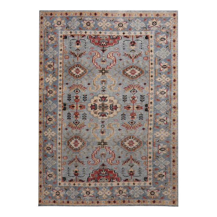 Manor hand-knotted slate grey wool rug with rust and red medallions, in a dining room