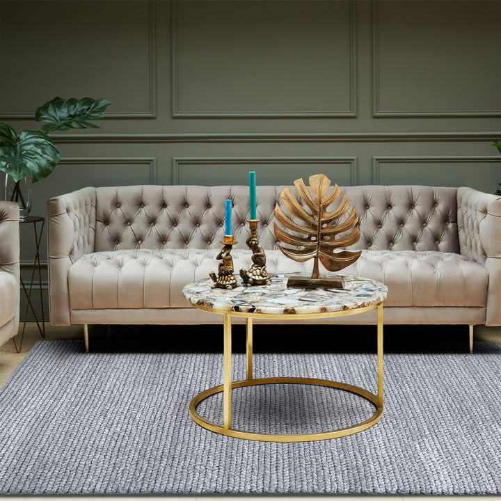 Dor handwoven chunky wool rug in charcoal, woven in thick cords, in a living room