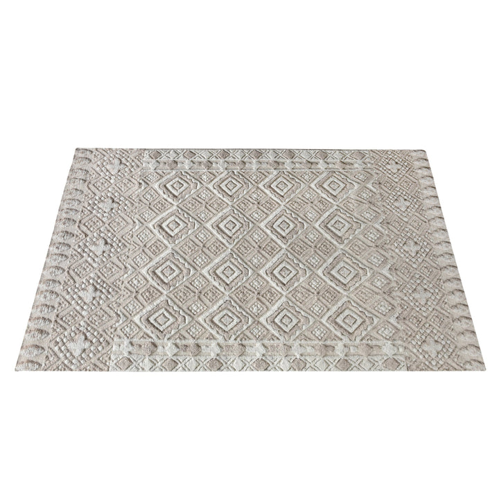 Malai hand-knotted ivory wool rug with a raised diamond lattice, under a dining table