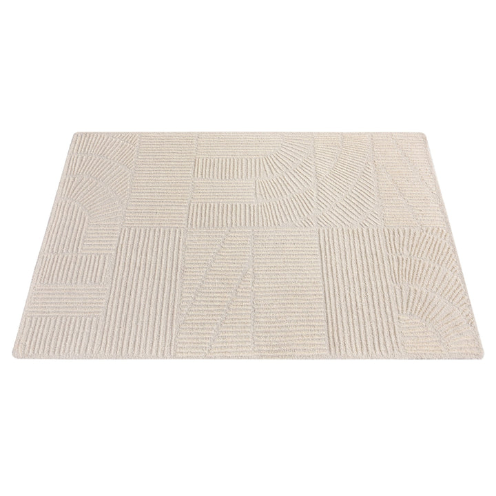 Kona handwoven cream wool rug with fine carved linear geometry, in a bedroom