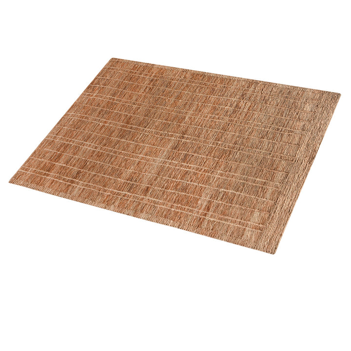 Geru hand-knotted jute rug in burnt sienna and tan with a rustic high pile, in a living room