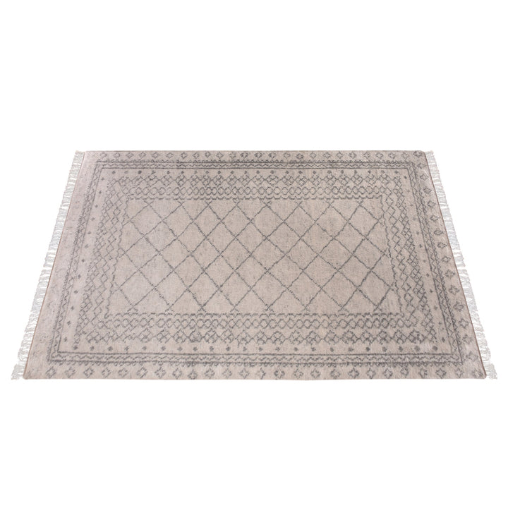 Phatak hand-knotted wool rug with an ivory diamond lattice and grey border, in a dining room