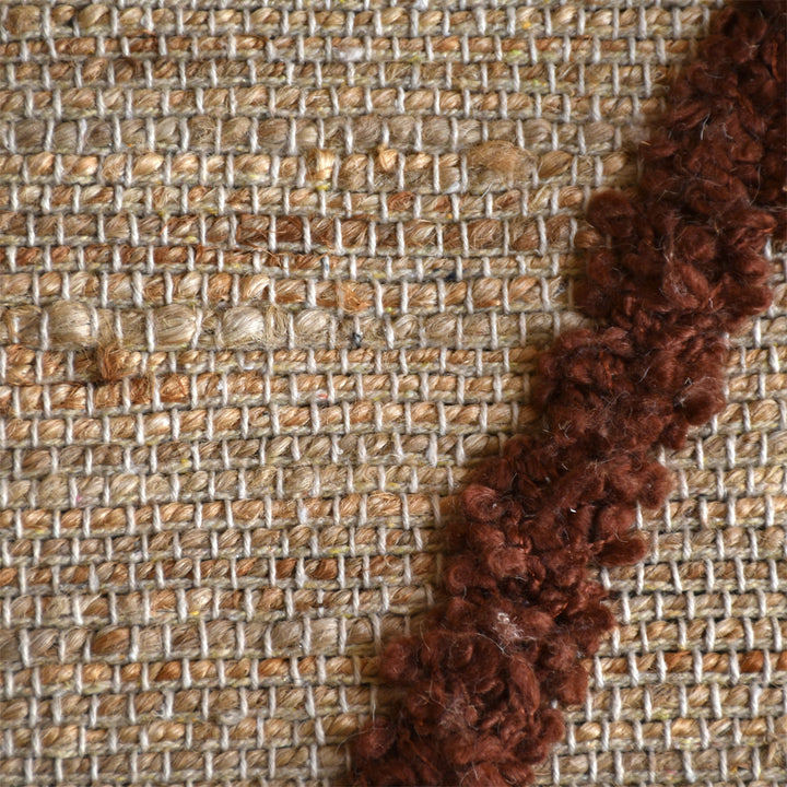 Lantern handwoven ivory hemp and PET rug with a rust diamond lattice, in a living room