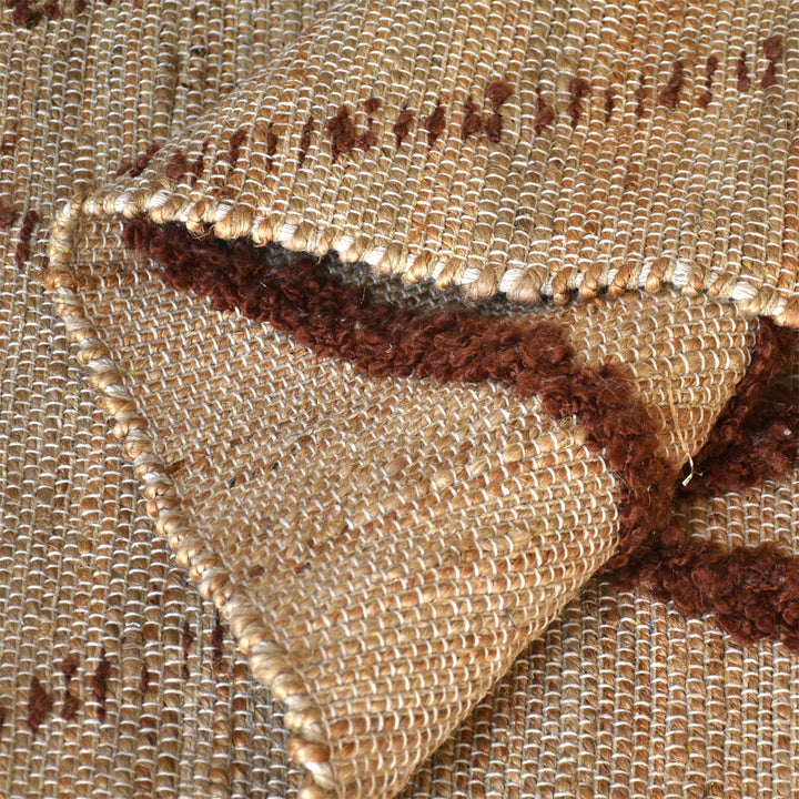 Lantern handwoven ivory hemp and PET rug with a rust diamond lattice, in a living room