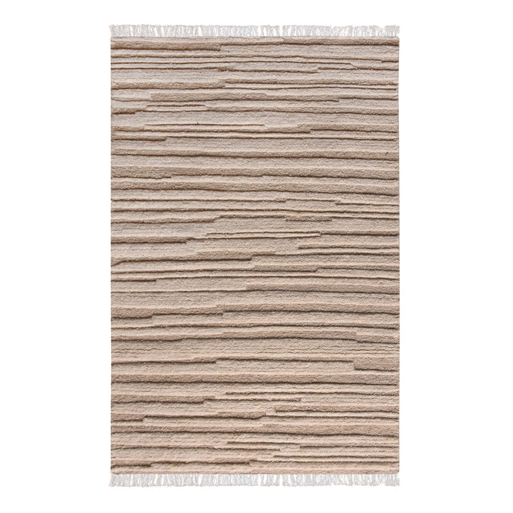 Pankti hand-knotted NZ wool rug in cream and oat with carved vertical stripes, in a dining room