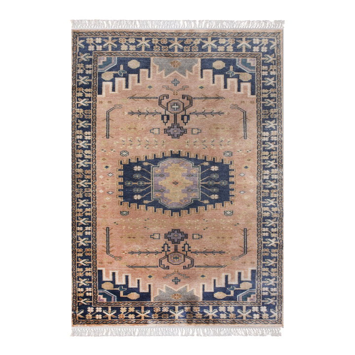Darbar hand-knotted wool rug with rust and navy Anatolian medallions, in a living room