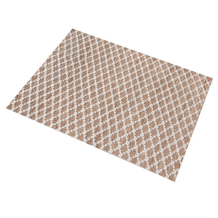 Lattice handwoven jute and wool rug with tan and ivory trellis pattern, in a dining room