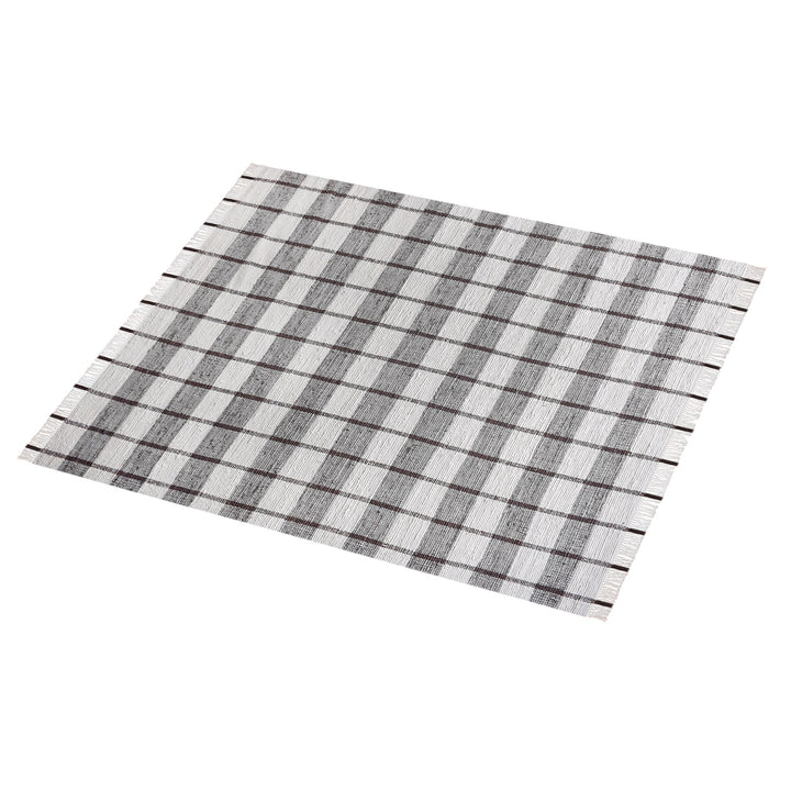 Gamcha handwoven recycled denim flatweave rug with a charcoal-grey and ivory buffalo check, in a living room