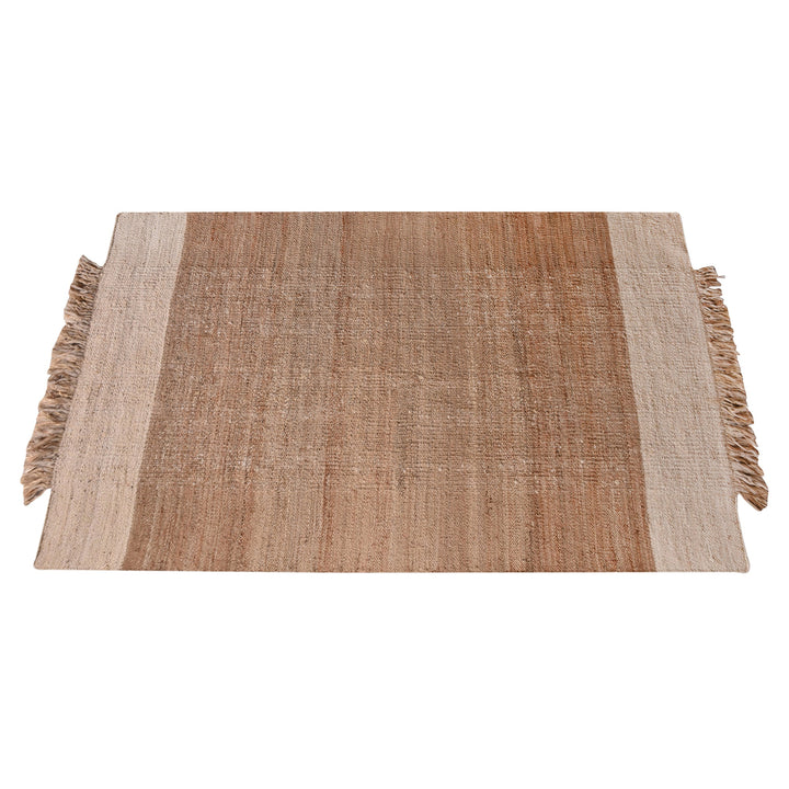 Sunbaked flatweave jute and wool rug in terracotta and blush colour blocks, in a living room