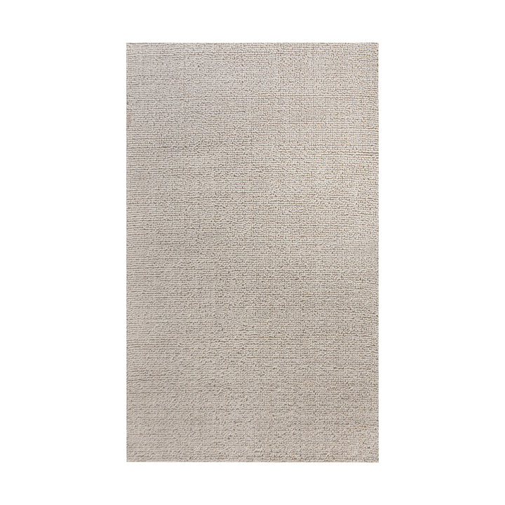 Lakeer handwoven ridged wool rug in oatmeal, tone on tone, in a bedroom