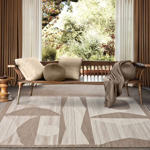Chhatri handwoven wool rug with bold ivory and beige arch blocks, in a living room