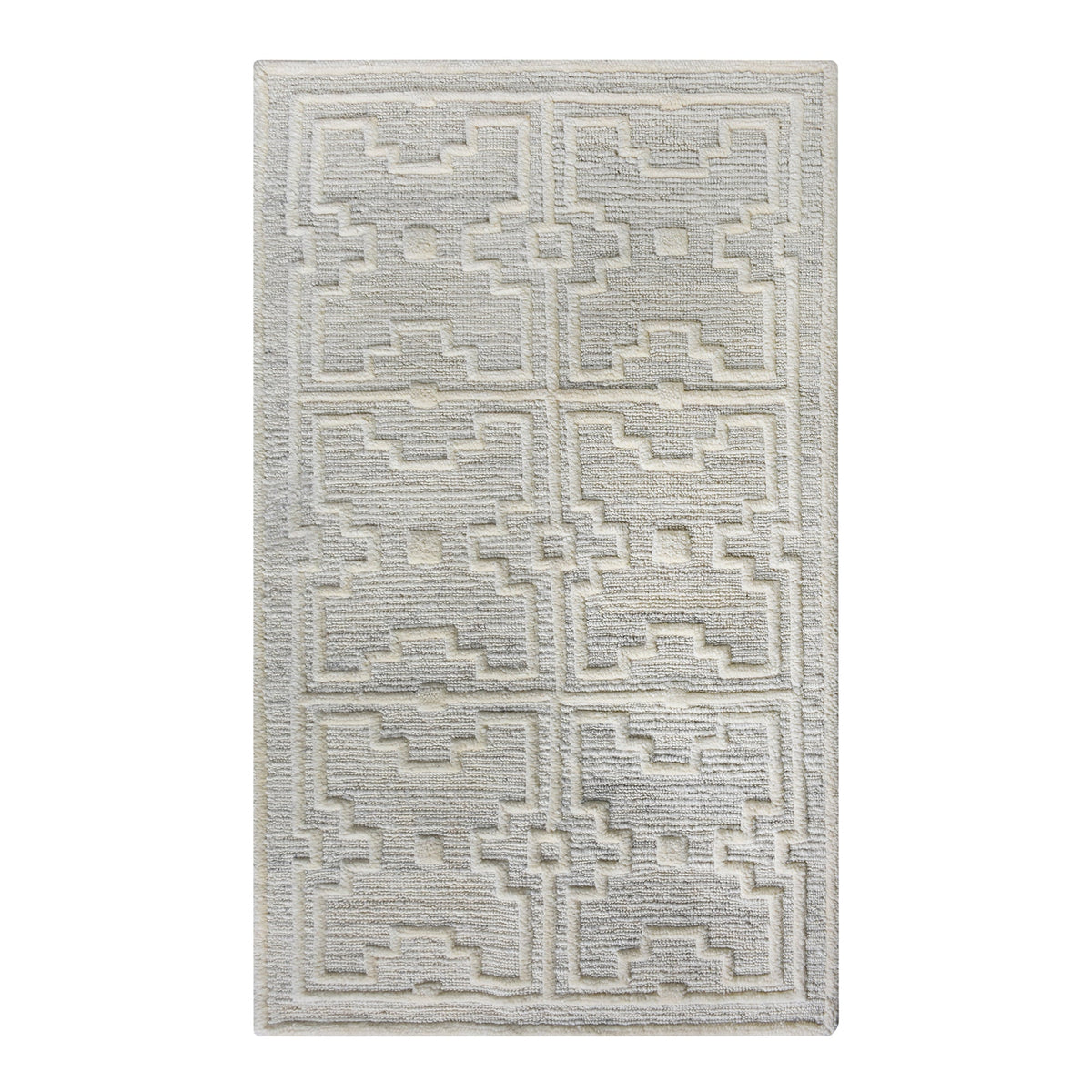 Chattan handwoven New Zealand wool rug with raised ivory diamonds on stone grey, in a living room