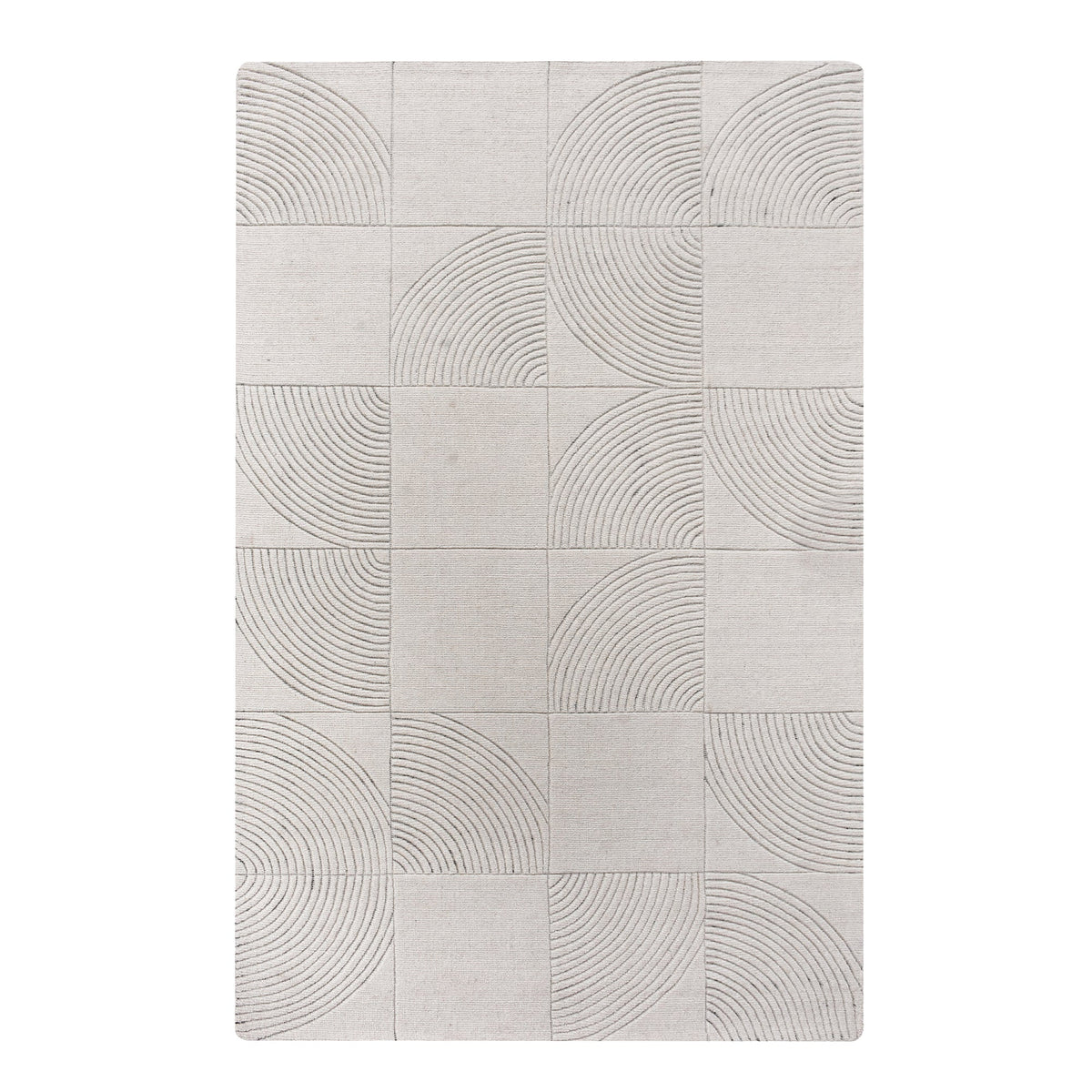 Seashell handwoven ivory wool rug with carved concentric arc tiles, in a bedroom