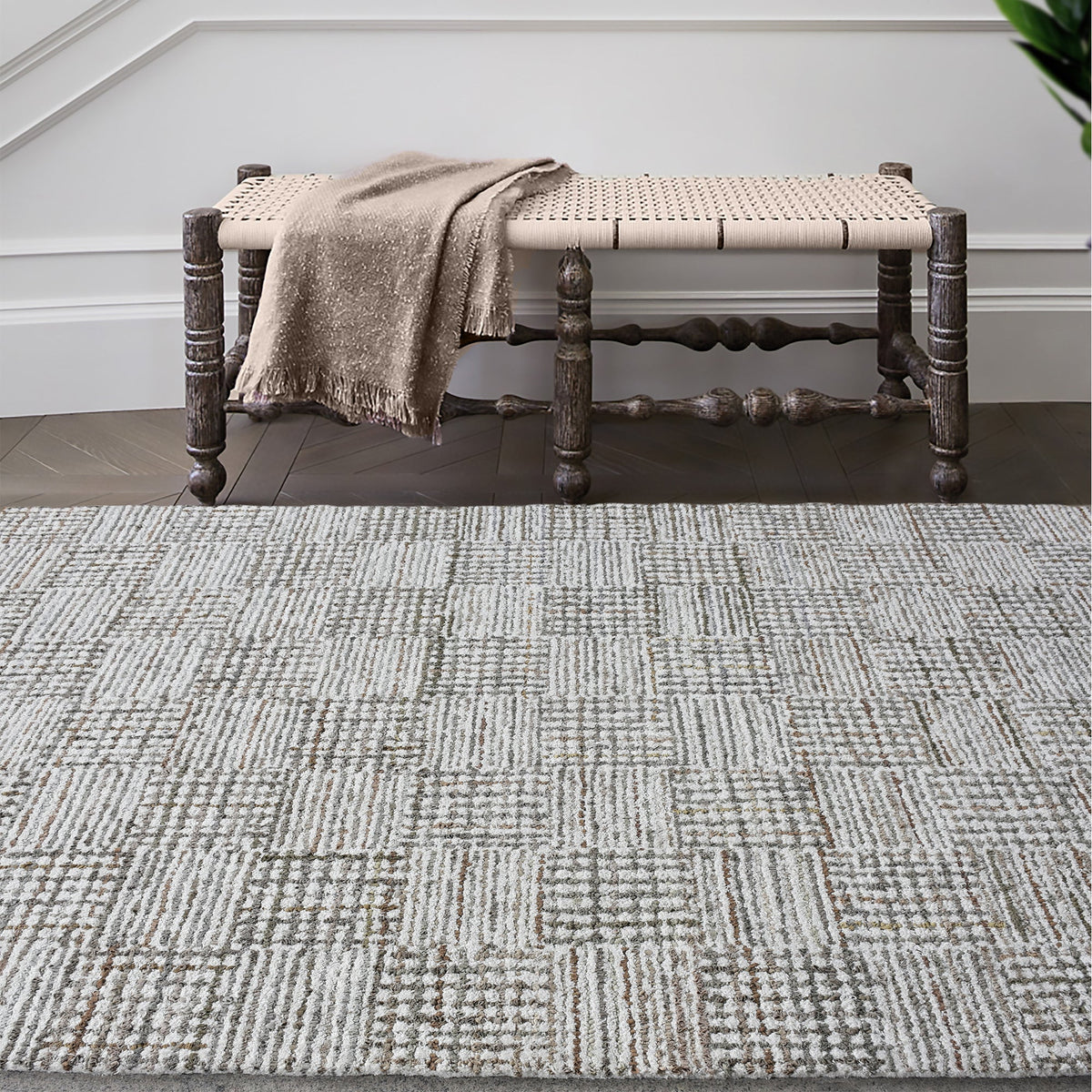 Tweed hand-tufted denim and cotton rug with fine grey and ivory check, in a bedroom