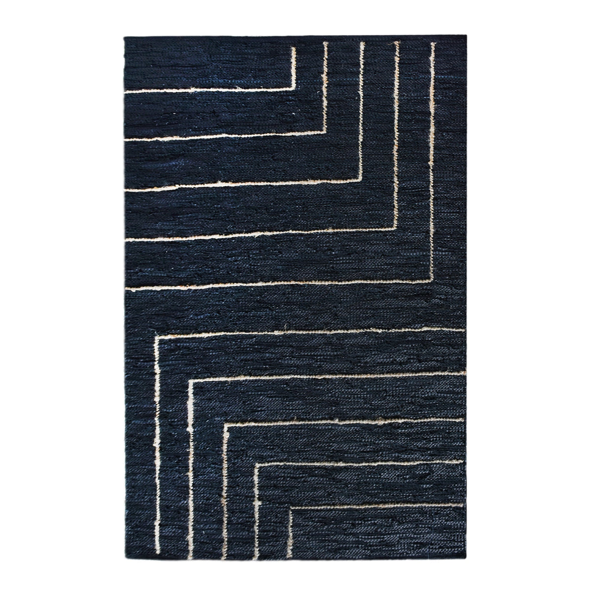 Aasmaan handwoven hemp and leather rug with cream nested angles on midnight navy, in a study
