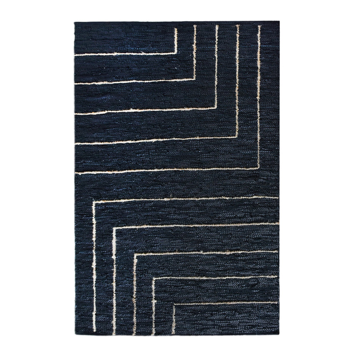 Aasmaan handwoven hemp and leather rug with cream nested angles on midnight navy, in a study