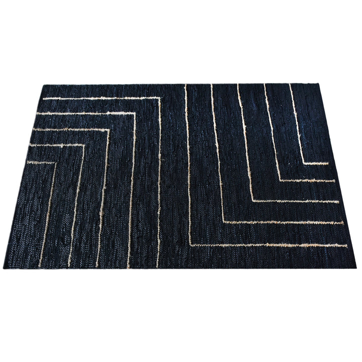 Aasmaan handwoven hemp and leather rug with cream nested angles on midnight navy, in a study