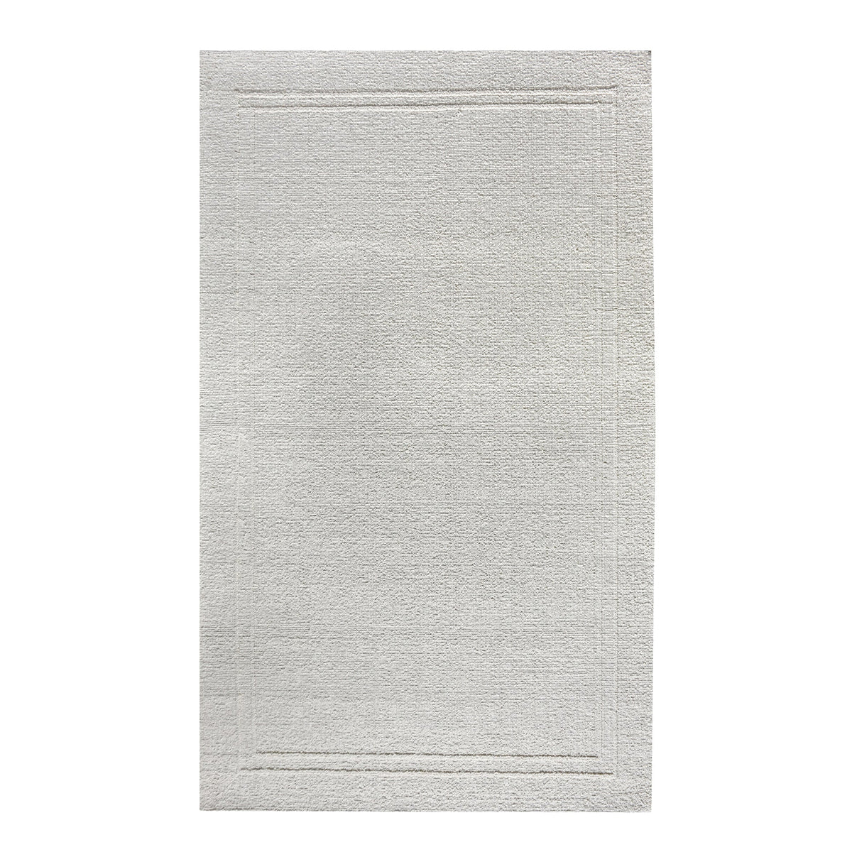 Margin handwoven ivory wool rug with a raised tonal border, in a living room