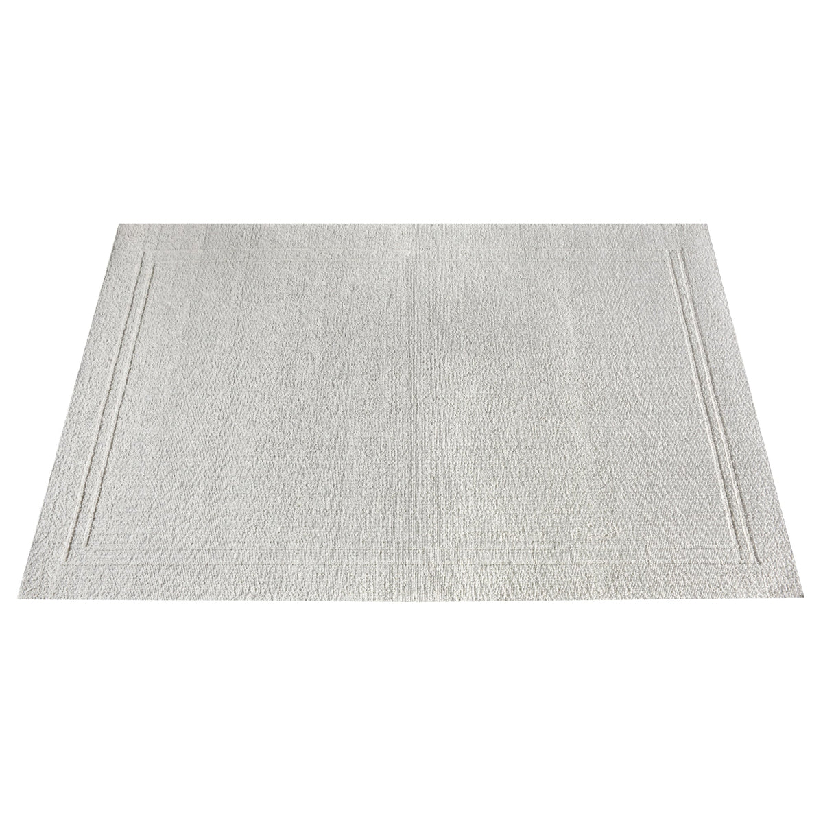 Margin handwoven ivory wool rug with a raised tonal border, in a living room