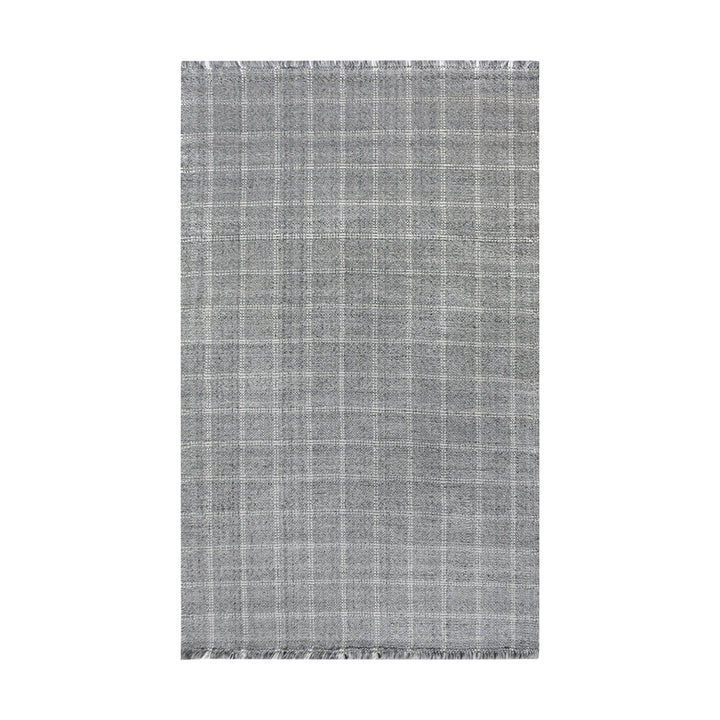 Pavilion handwoven slate grey and ivory recycled PET rug with a window-pane check, on a patio
