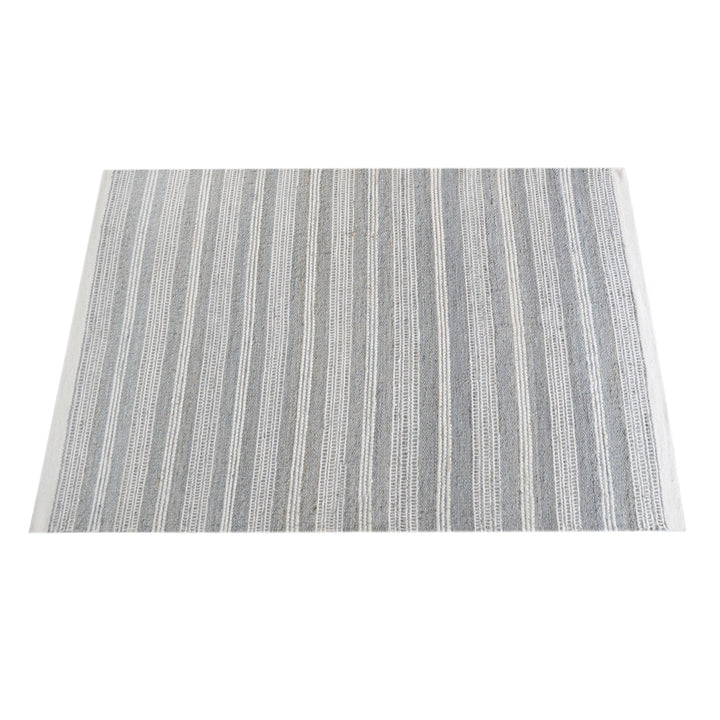 Pinstripe handwoven hemp and wool rug with slate and ivory vertical stripes, in a hallway