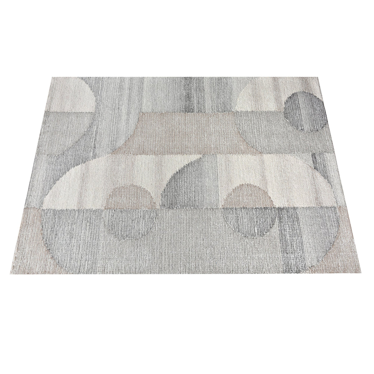 Ghera handwoven pale grey wool rug with overlapping cream circles, in a living room