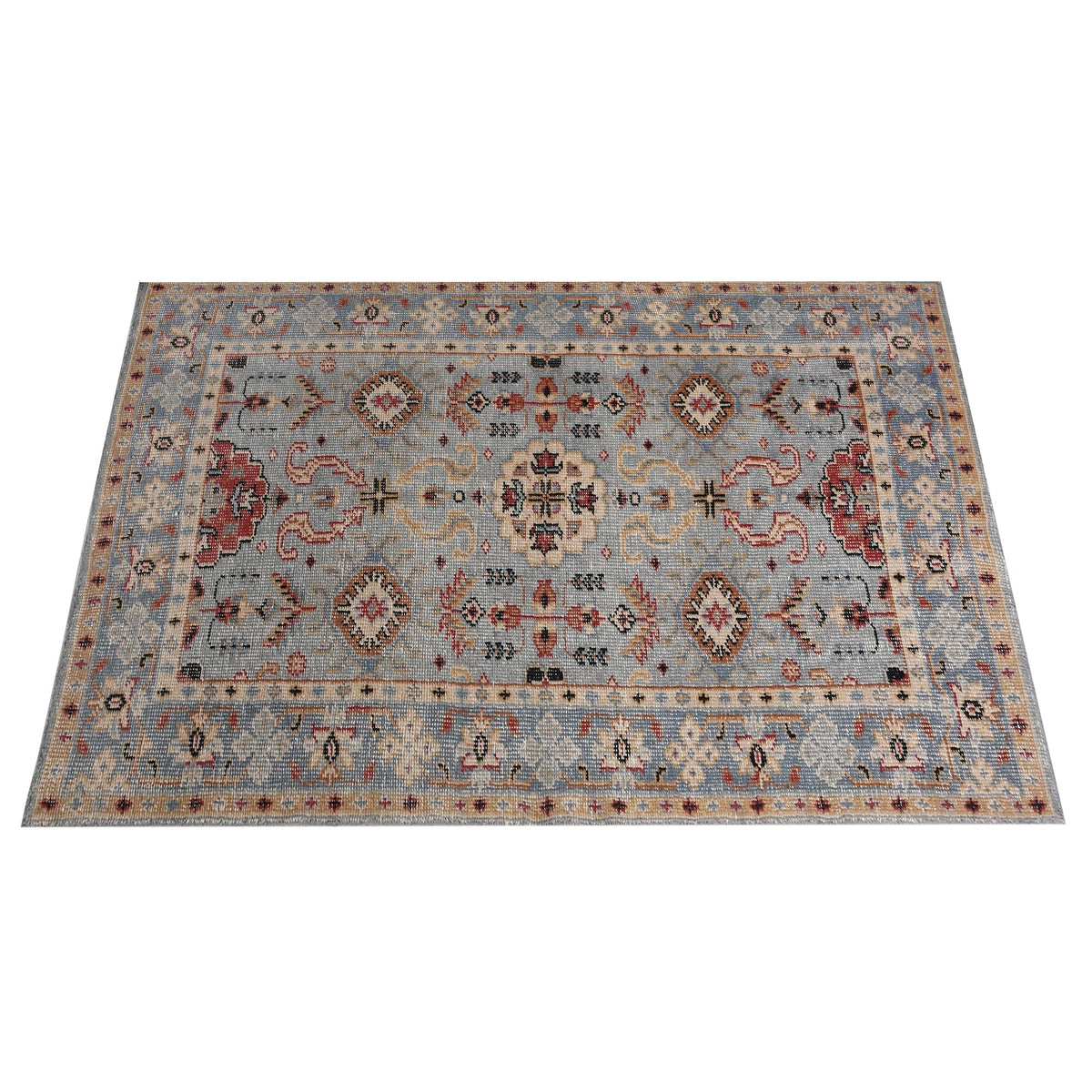 Manor hand-knotted slate grey wool rug with rust and red medallions, in a dining room