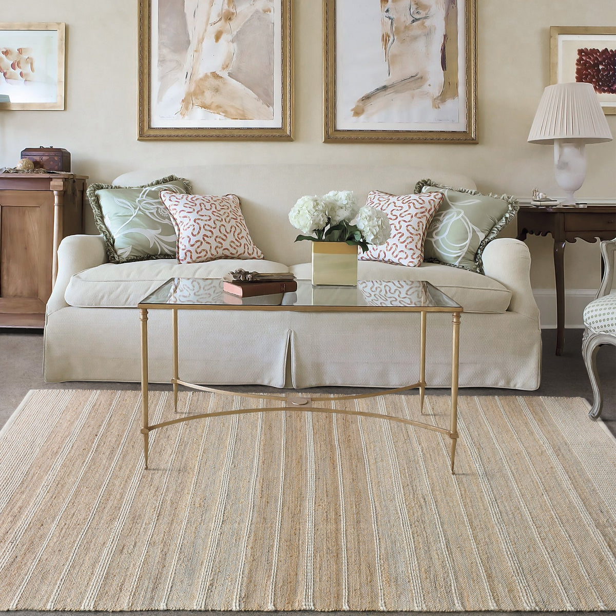 Taar handwoven wool and jute rug with fine vertical ribs in bleached natural and ivory, in a bedroom