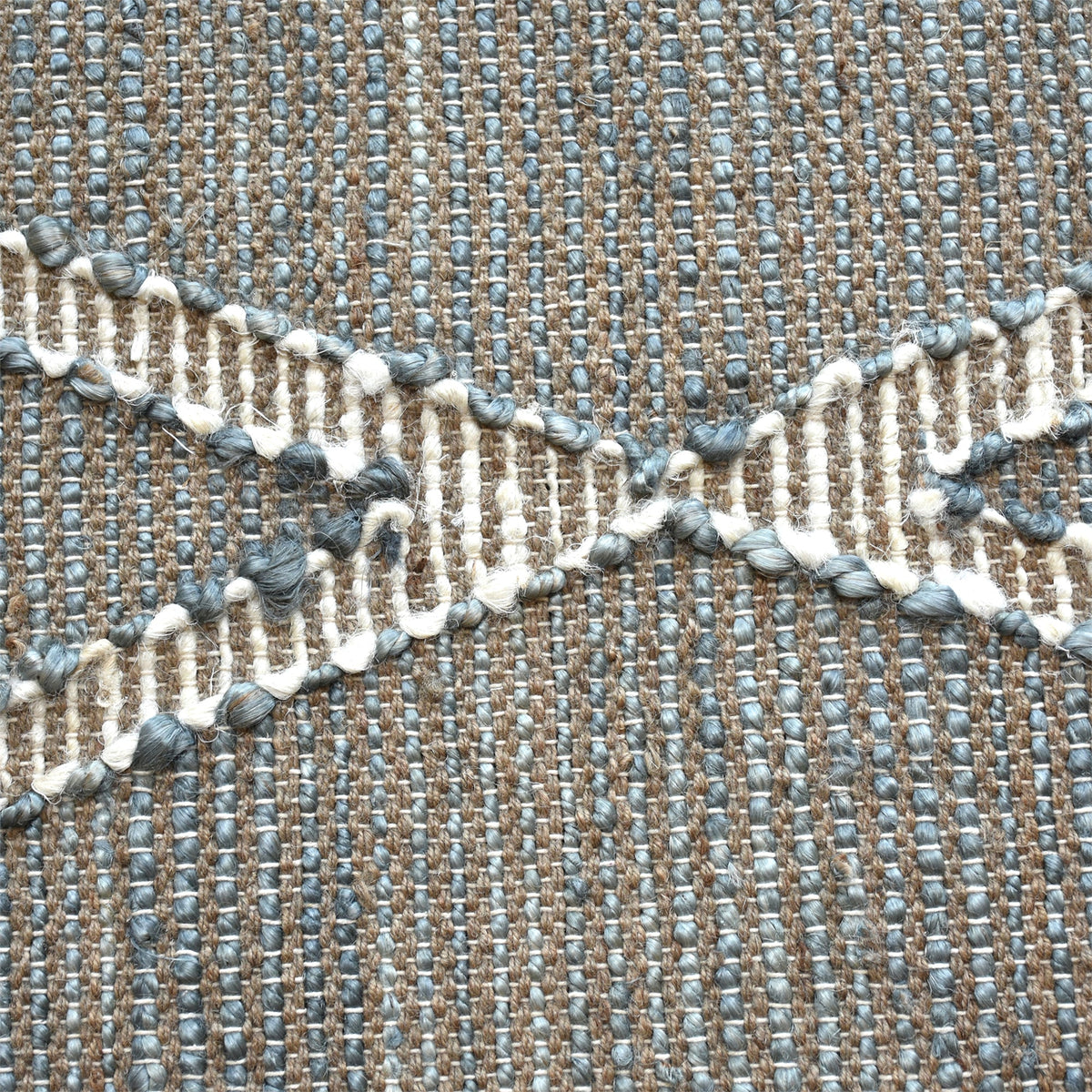 Thyme handwoven hemp rug with an ivory diamond lattice on sage grey, in a dining room
