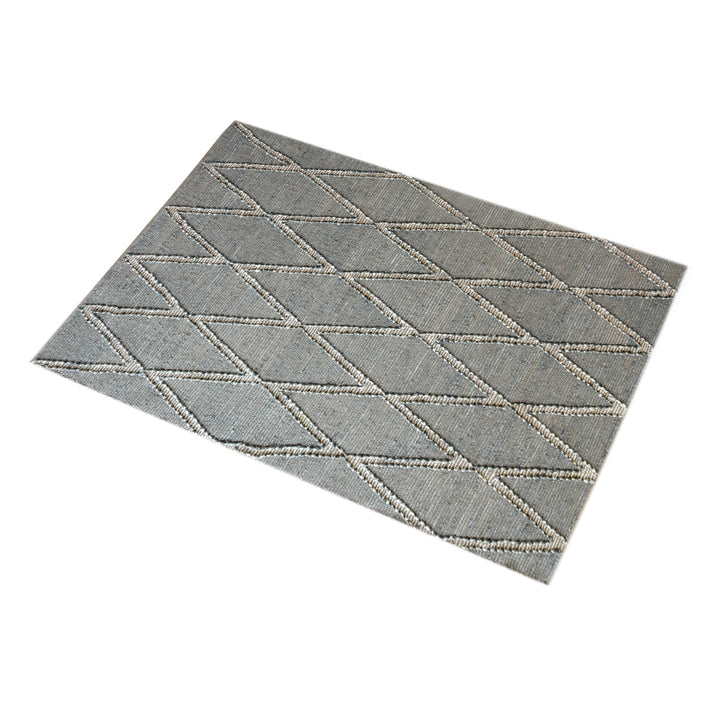 Thyme handwoven hemp rug with an ivory diamond lattice on sage grey, in a dining room