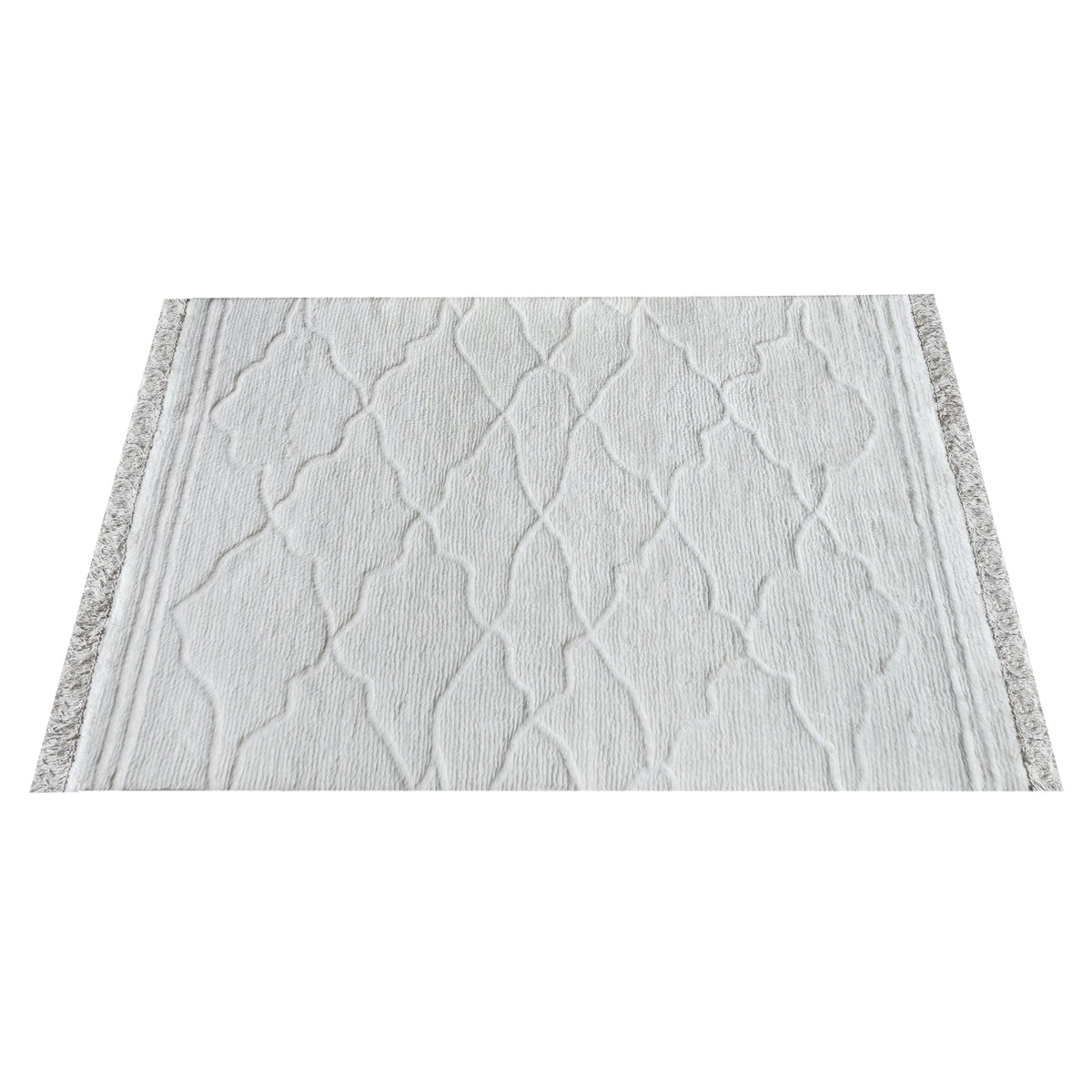 Kangan tufted wool rug with a tonal carved Moroccan lattice in bone ivory, in a bedroom