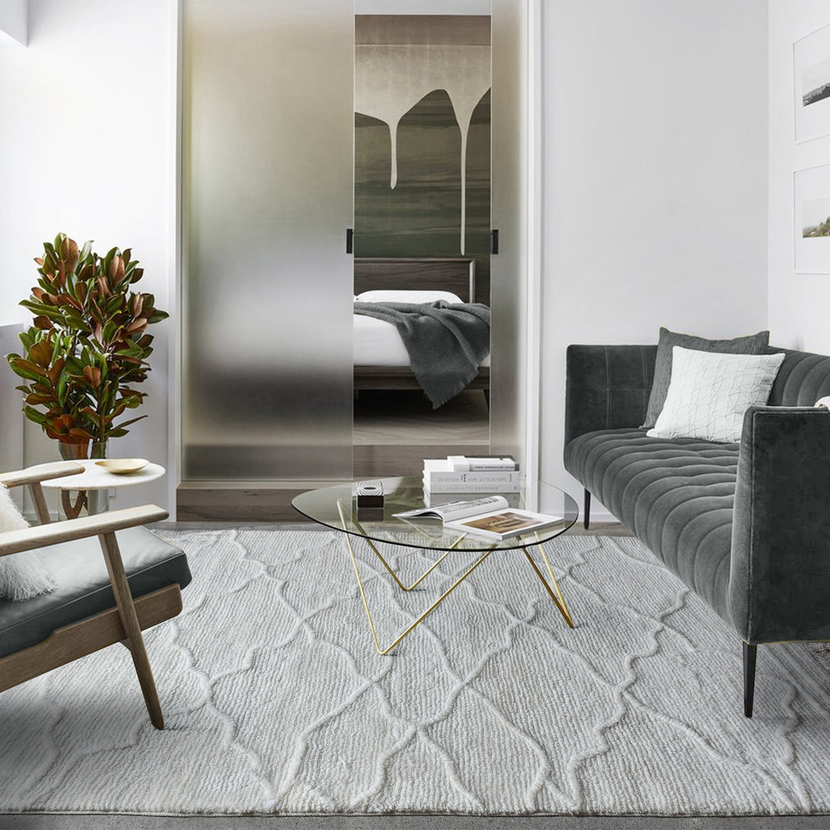 Kangan tufted wool rug with a tonal carved Moroccan lattice in bone ivory, in a bedroom