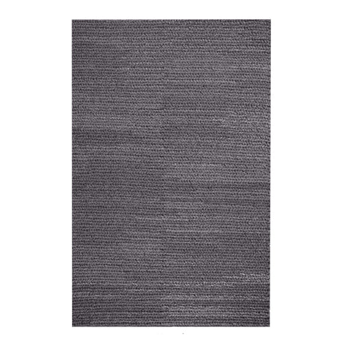 Dor handwoven chunky wool rug in charcoal, woven in thick cords, in a living room