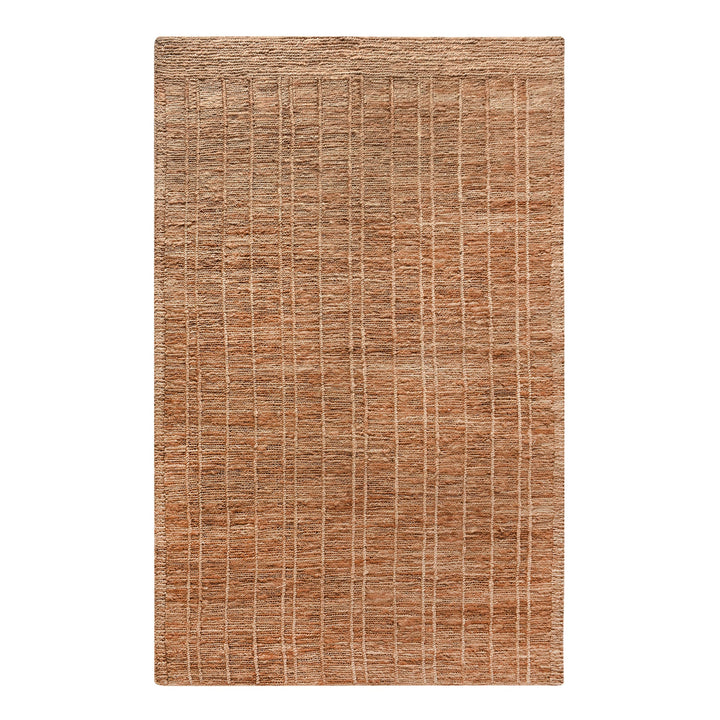 Geru hand-knotted jute rug in burnt sienna and tan with a rustic high pile, in a living room