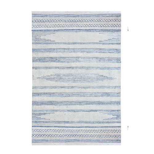 Breton handwoven denim and wool rug with blue and cream horizontal stripes, in a home office