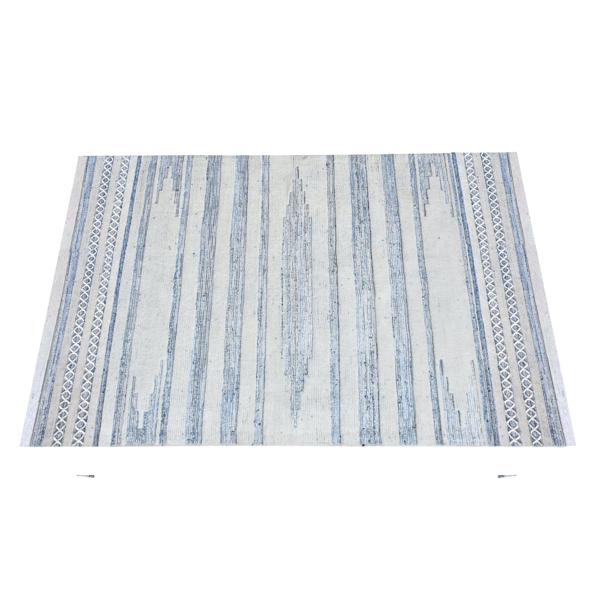 Breton handwoven denim and wool rug with blue and cream horizontal stripes, in a home office