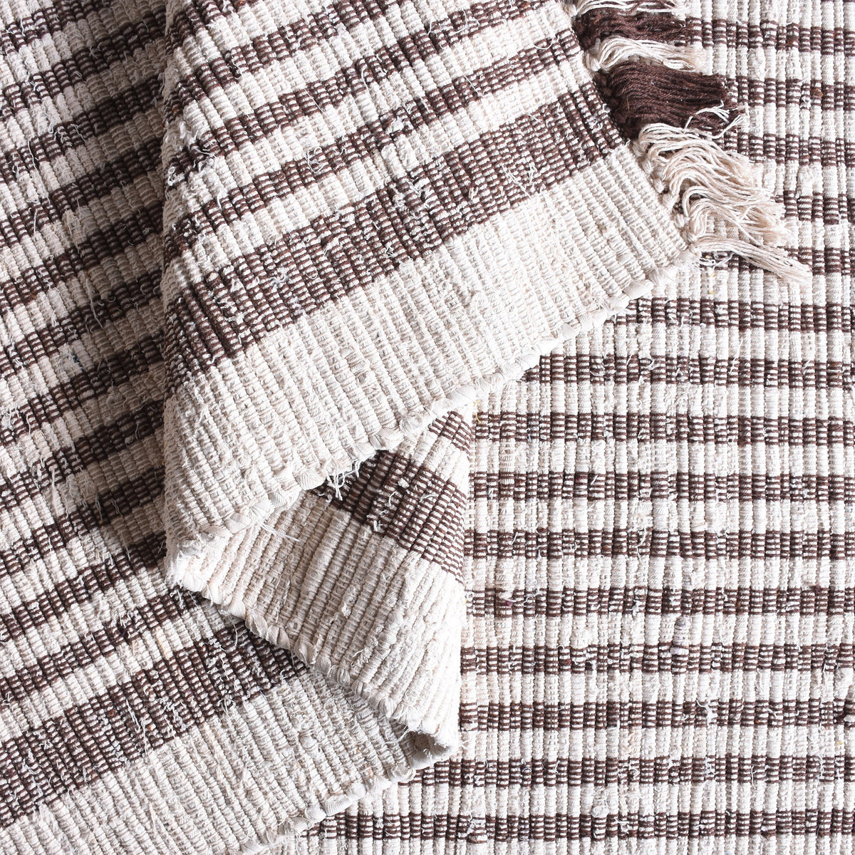 Dari handwoven recycled denim and cotton flatweave rug with fine ivory and taupe stripes and fringed ends