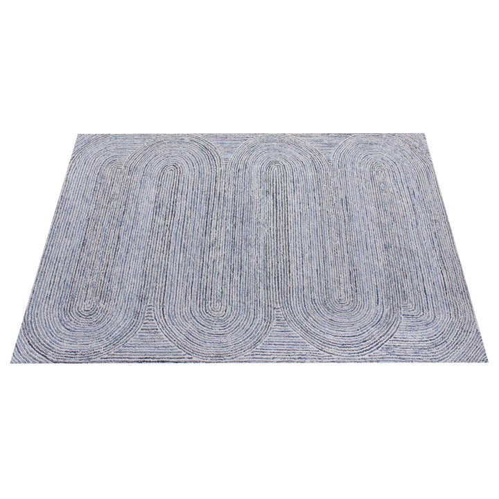 Estuary handwoven wool and denim rug with denim blue contour lines on ivory, in a dining room