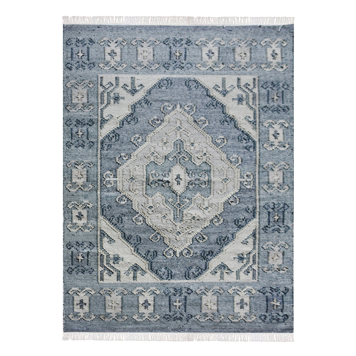 Courtyard flatweave slate blue recycled PET rug with an ivory Heriz medallion, on a patio