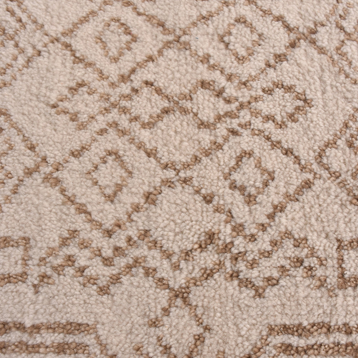 Gulab hand-knotted NZ wool rug with a blush medallion on an ivory field, in a bedroom
