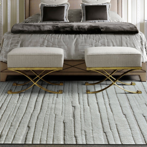 Bark handwoven ivory wool rug with carved vertical ridges, in a living room