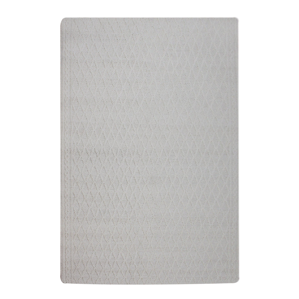 Jaal handwoven ivory wool rug with a raised cabled diamond lattice, in a living room